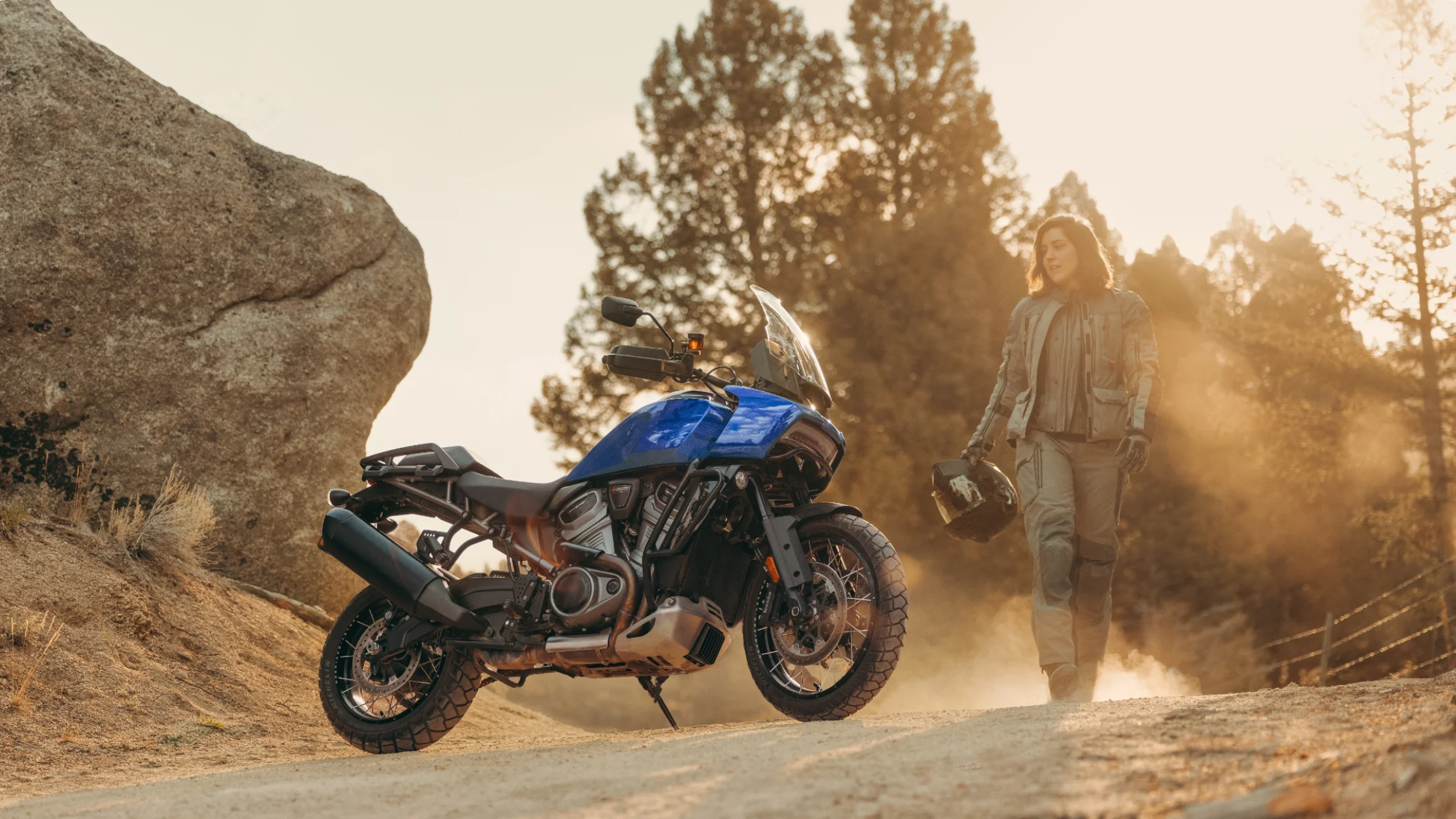 2025 Harley-Davidson Pan America 1250 Special adventure bike on dirt trail at sunset.