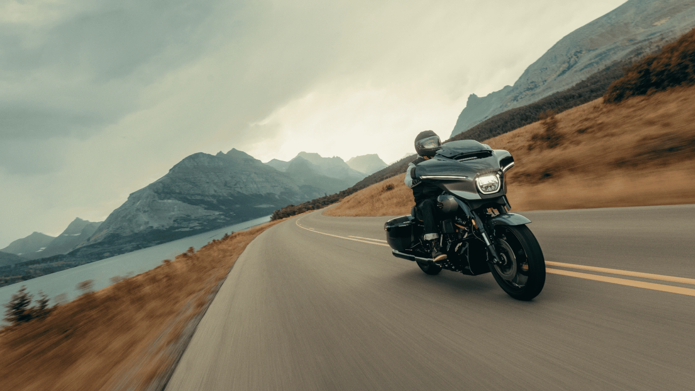 2025 Harley-Davidson CVO Street Glide riding on a mountain road, showing premium touring performance for Sunrise riders.