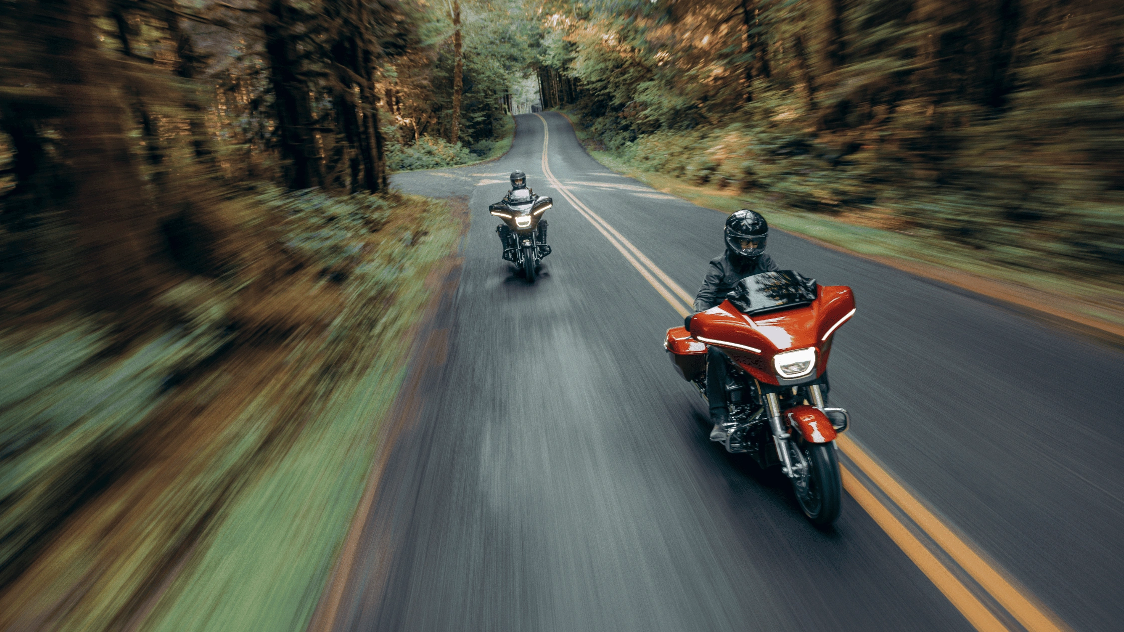 2025 Harley-Davidson® Street Glide® leading on Baton Rouge roads, emphasizing superior touring performance and comfort versus rivals.
