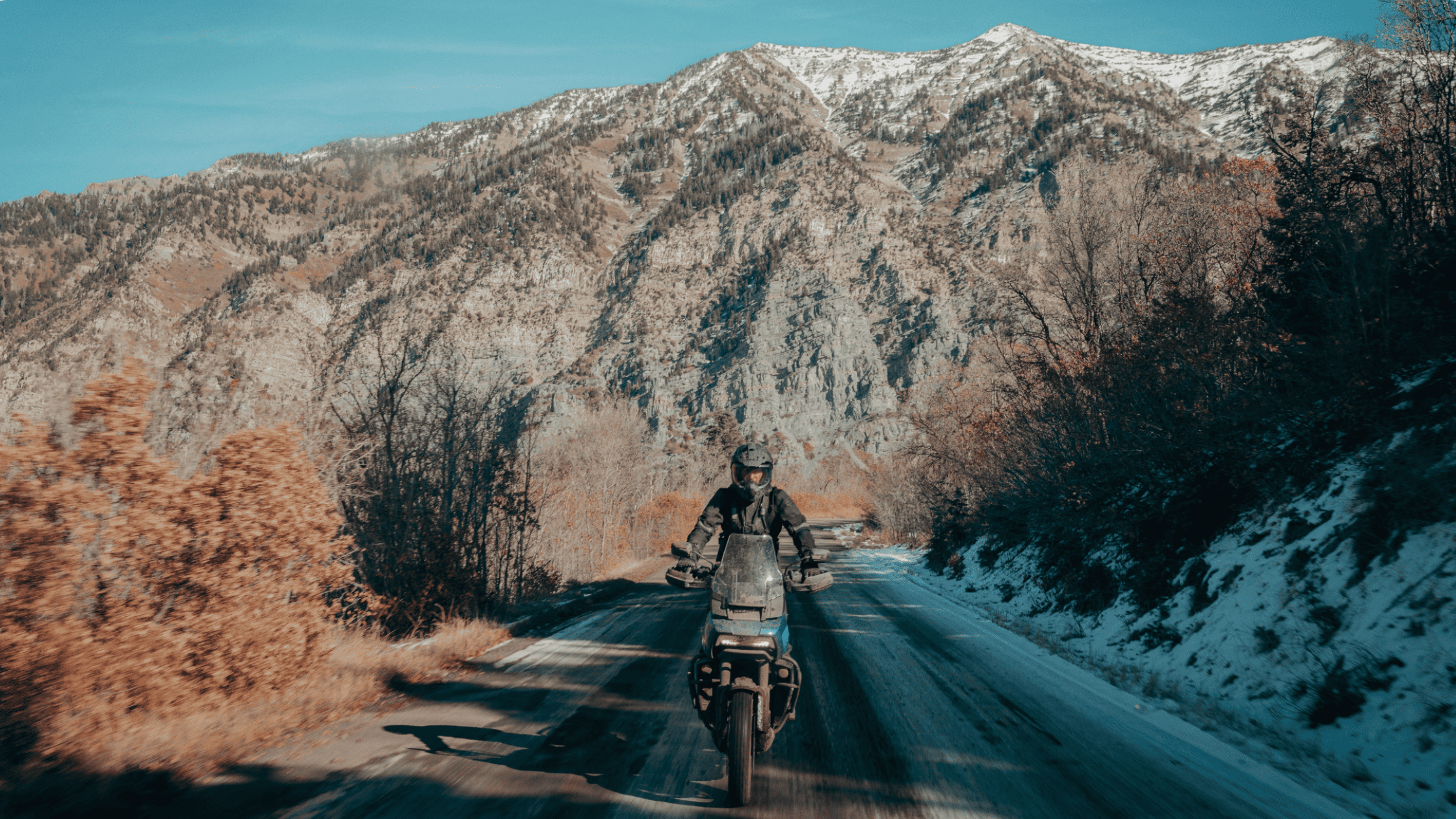 2025 Harley-Davidson® Pan America® 1250 Special motorcycle riding through snow-covered mountain roads.