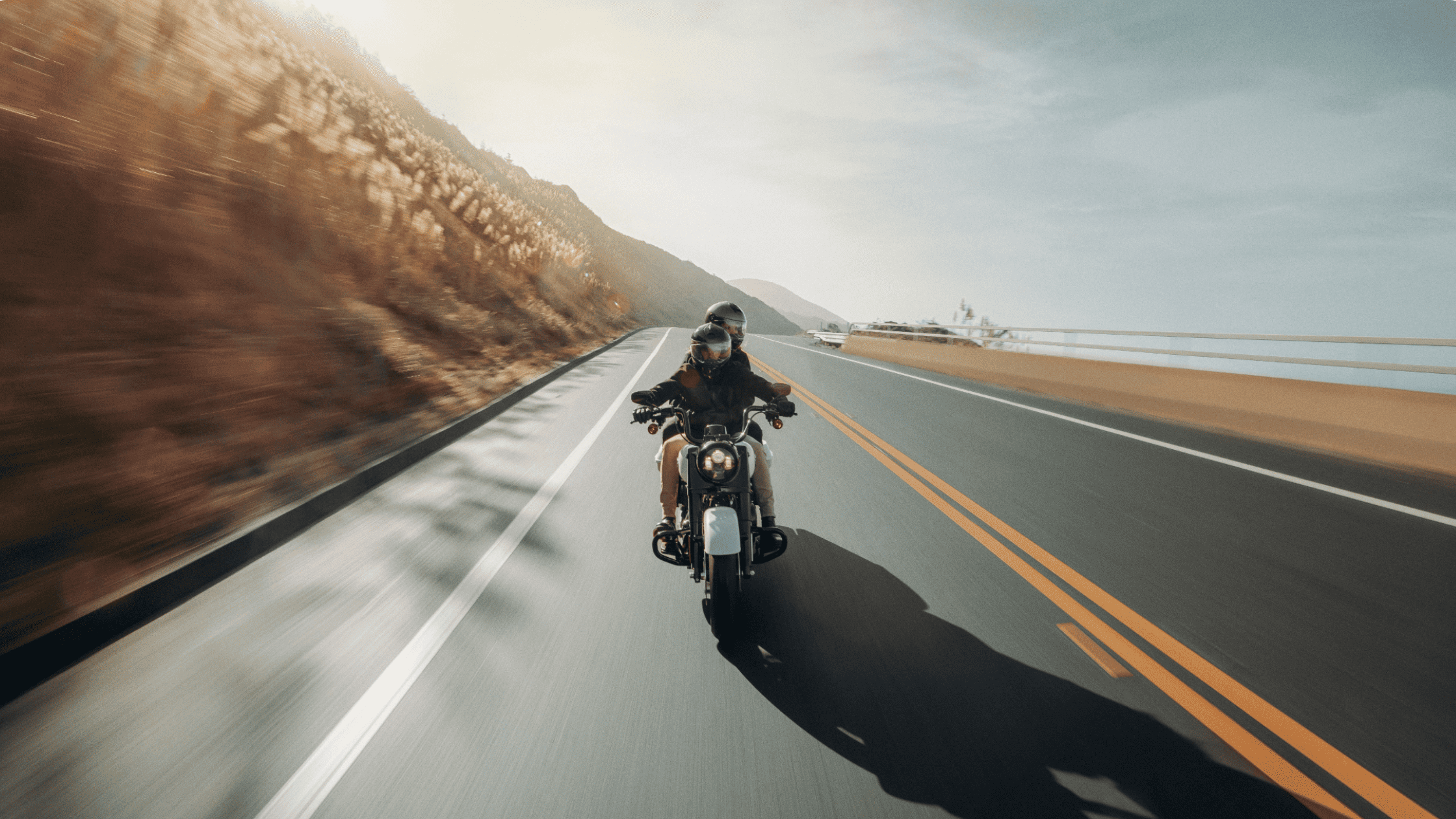 Rider on a 2025 Harley-Davidson® Road King® Special navigating scenic curves, featuring its Milwaukee-Eight® 114 engine and commanding stance.