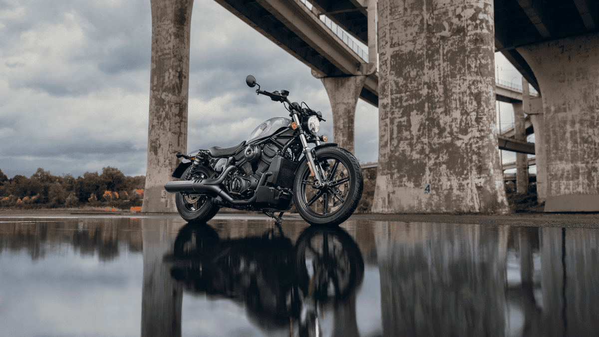 2025 Harley-Davidson® Nightster® parked under a bridge near Palm Bay, FL, showcasing its dark custom style against an urban backdrop.
