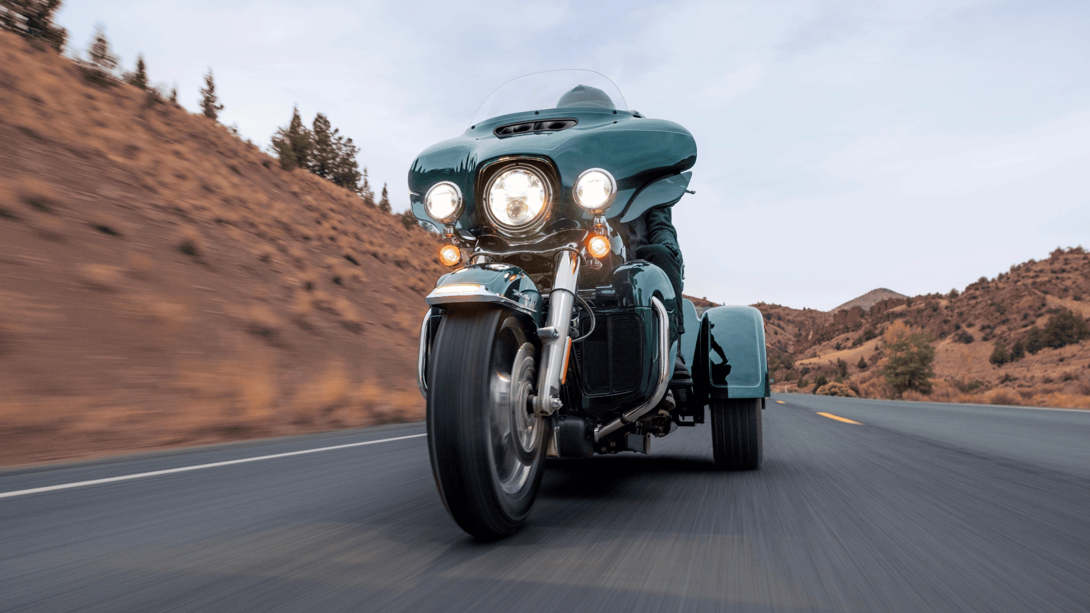 2025 Harley-Davidson Tri Glide Ultra in Baton Rouge LA riding on a rural road.