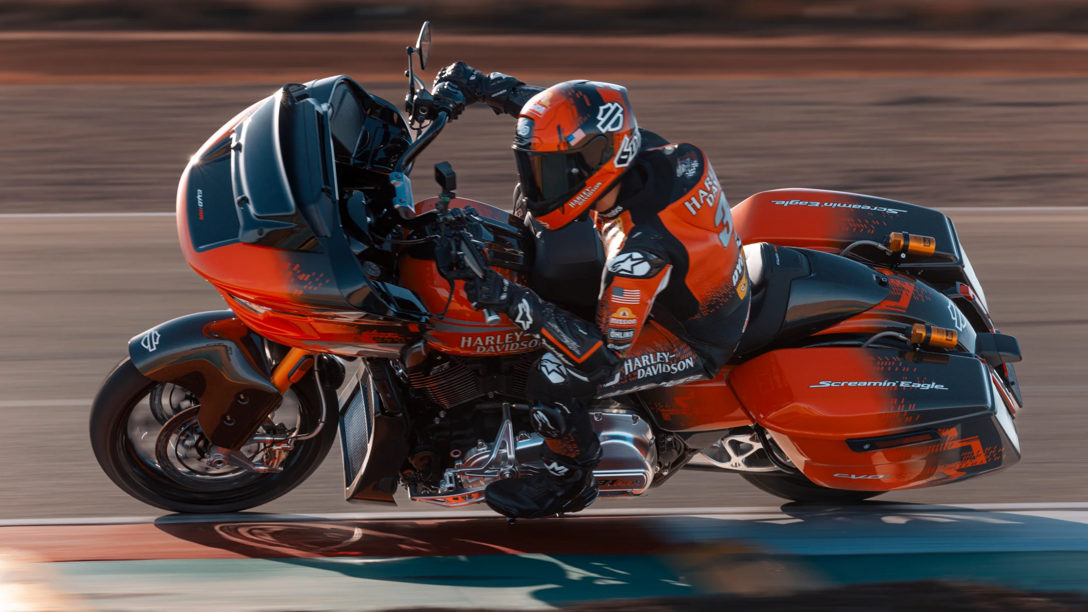 2025 CVO™ Road Glide® race bike carving a track corner with rider in full racing gear and lean angle.