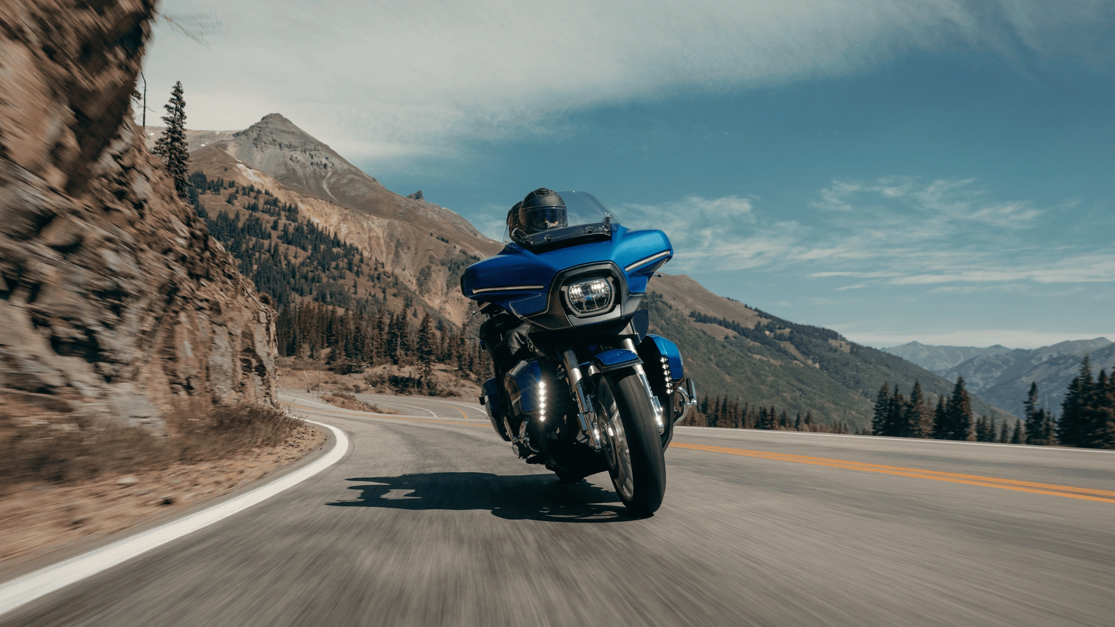 2026 Harley-Davidson CVO Street Glide Limited touring motorcycle shown on an open road in Baton Rouge, LA, offering luxury features, passenger comfort, and storage.