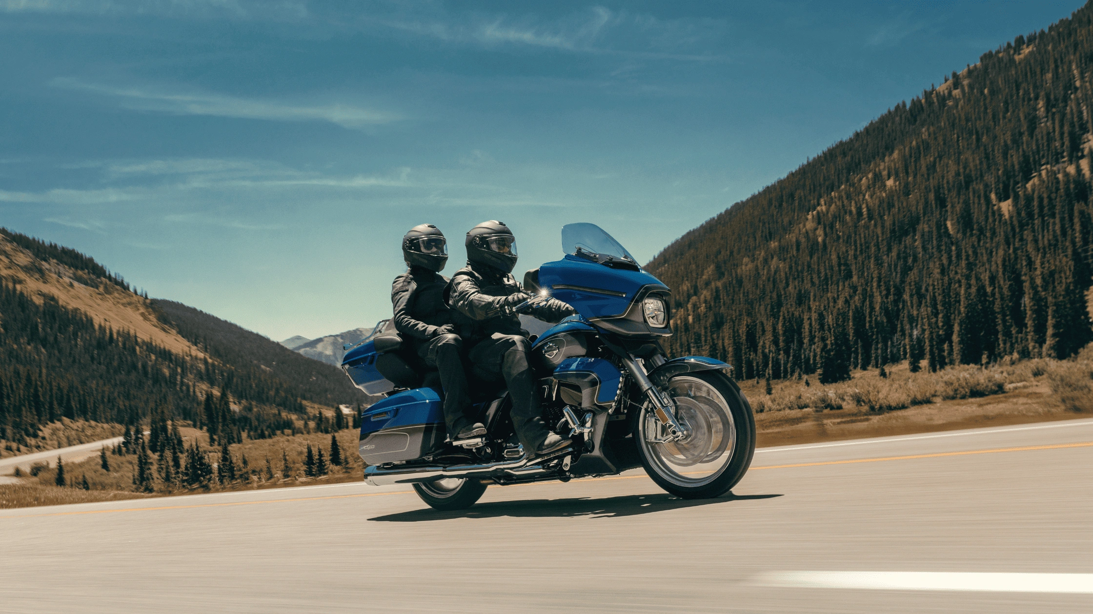 2026 Harley-Davidson CVO Street Glide Limited cruising on an open highway, showcasing touring comfort, advanced tech features, and long-distance riding performance.