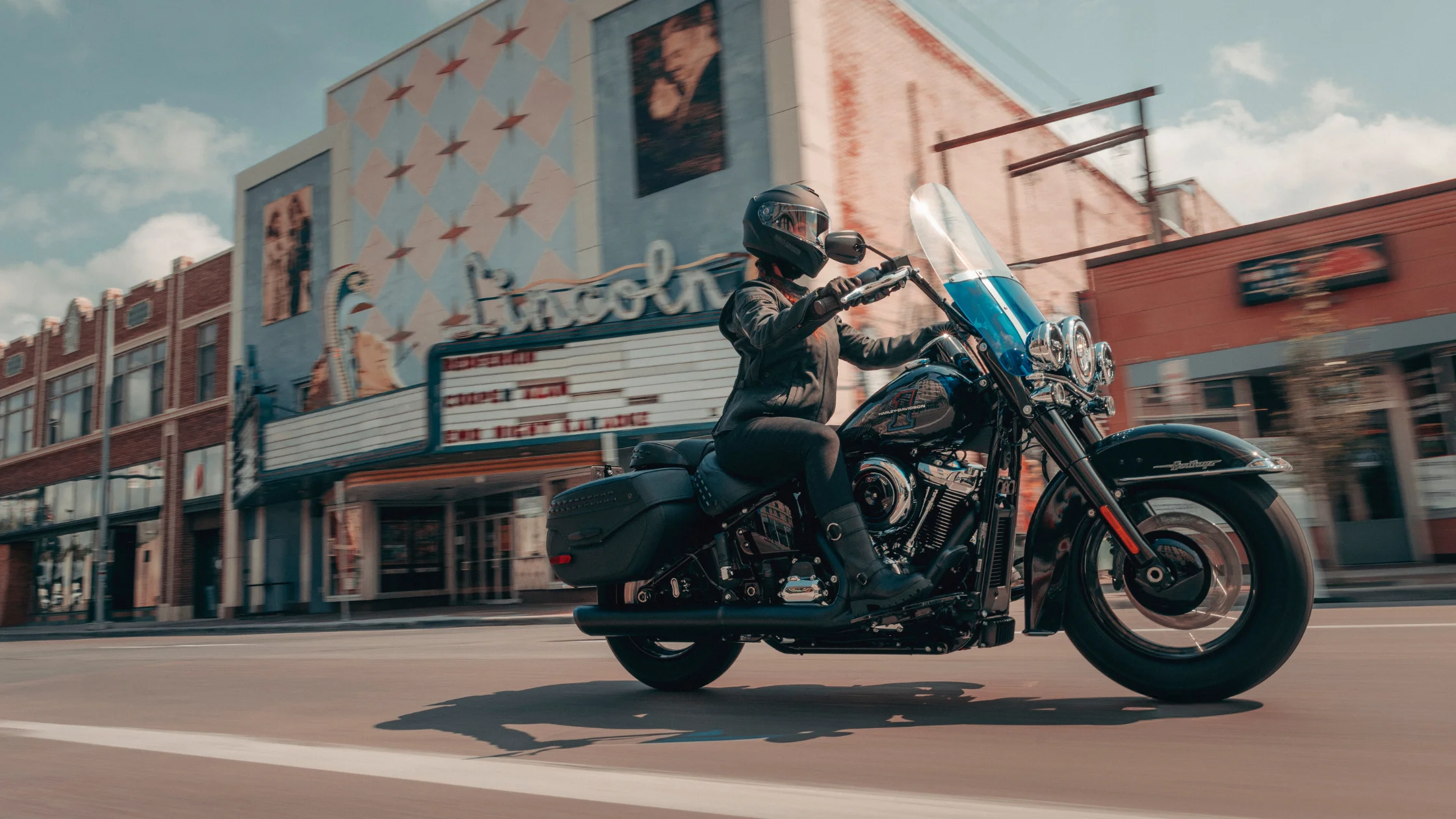2026 H-D® Heritage Classic touring cruiser motorcycle riding downtown street