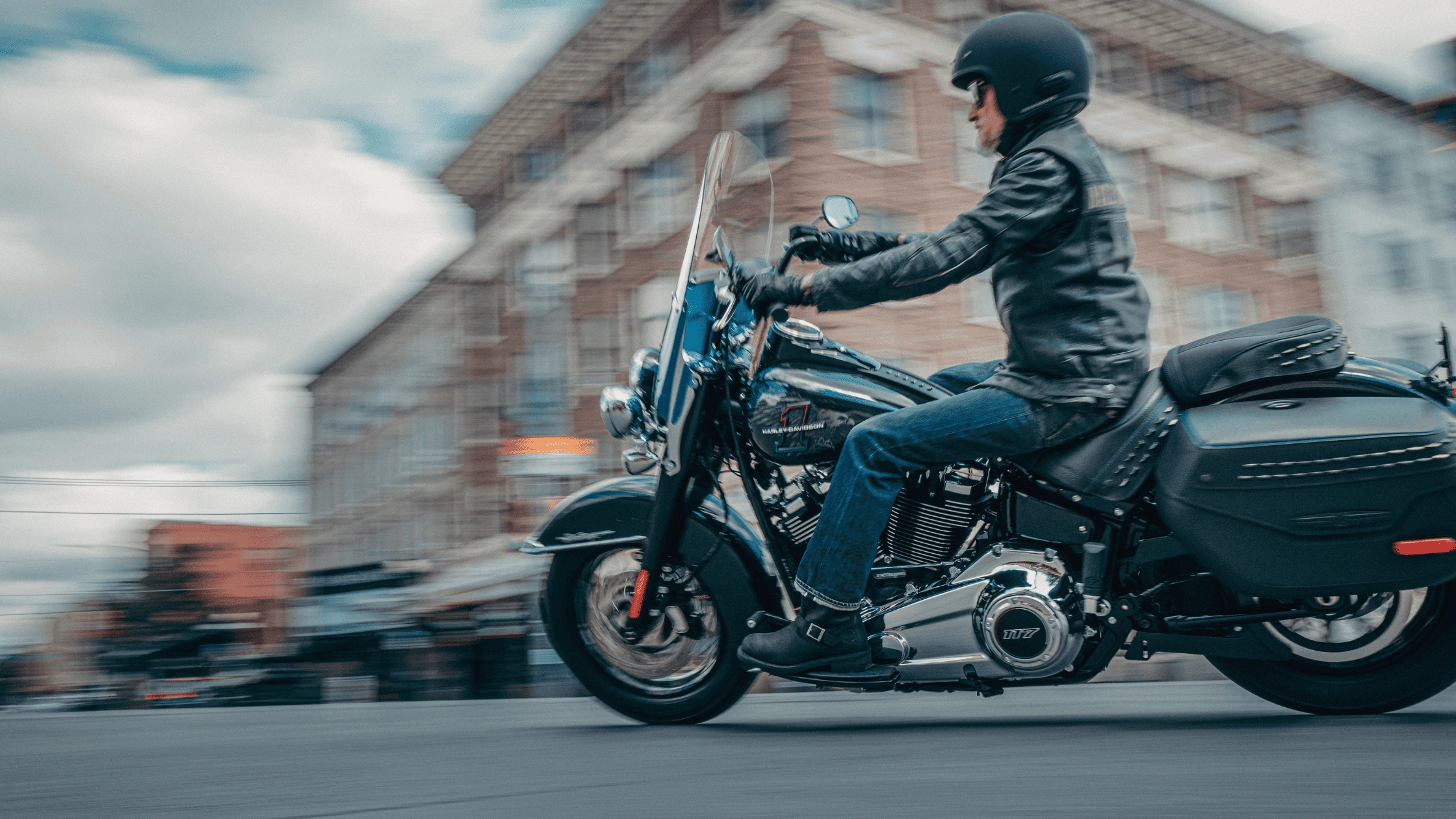 Rider cruising on a 2026 Harley-Davidson Heritage Classic motorcycle through Baton Rouge, LA.