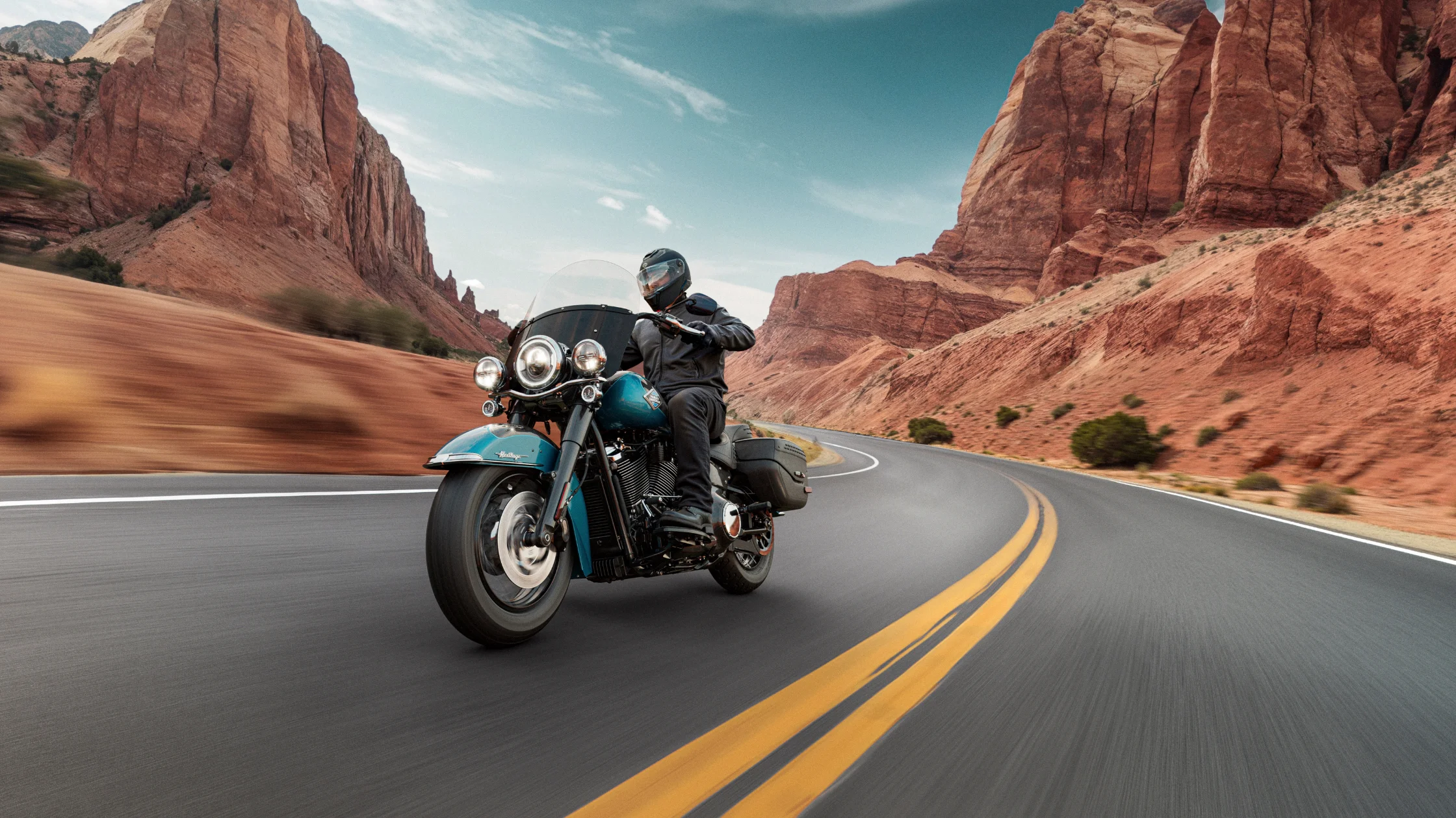 Black 2026 H-D® Heritage Classic with windshield parked at a scenic overlook