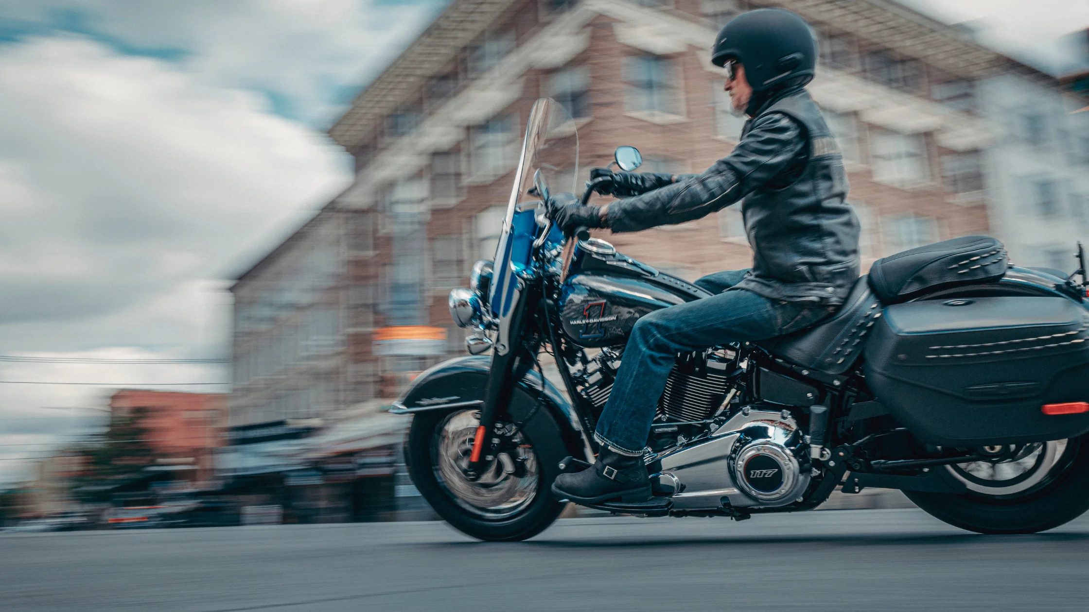 2026 Harley-Davidson® Heritage Classic riding through city street.