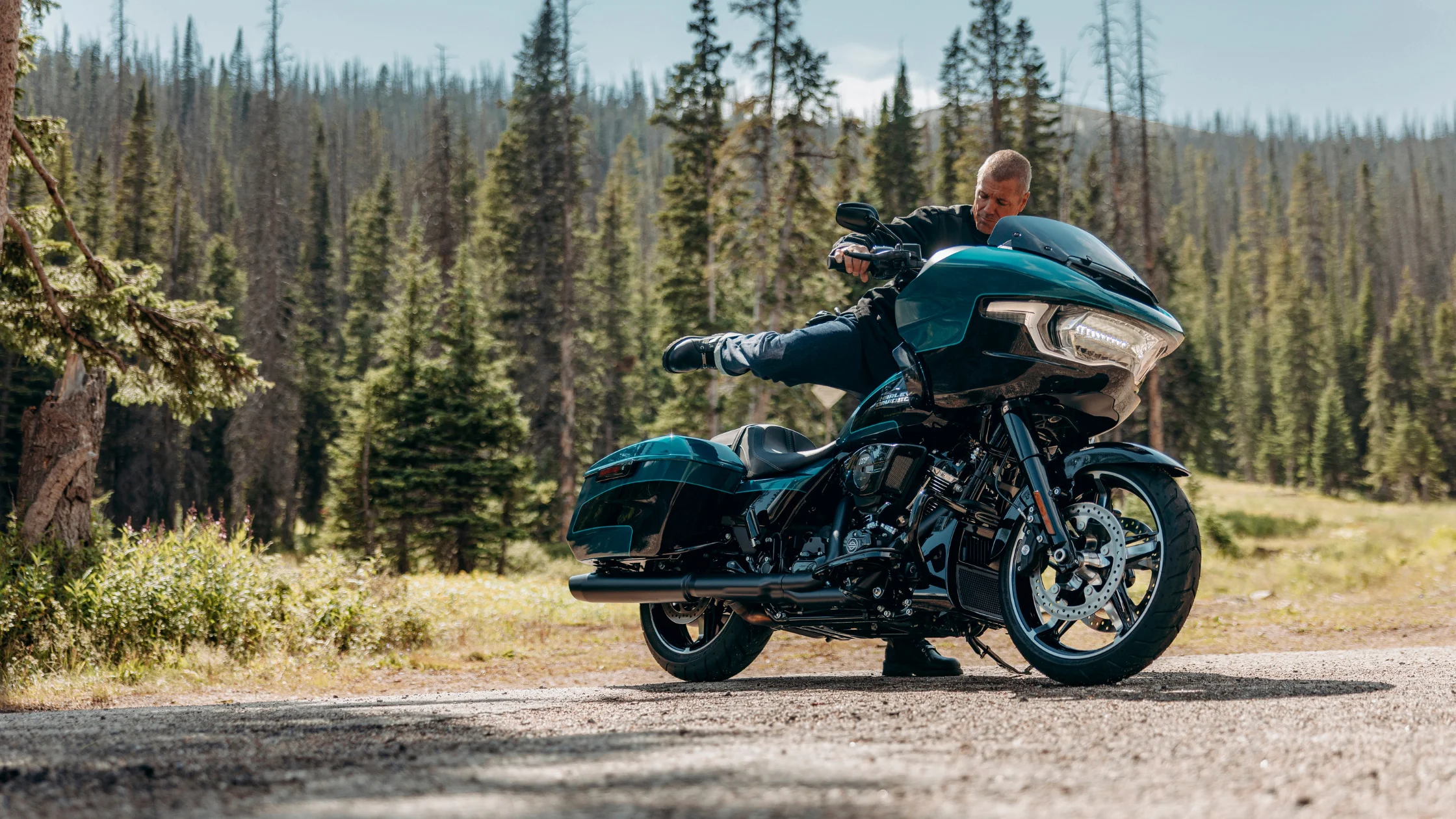 2026 Harley-Davidson® Road Glide® motorcycle parked near a forest road