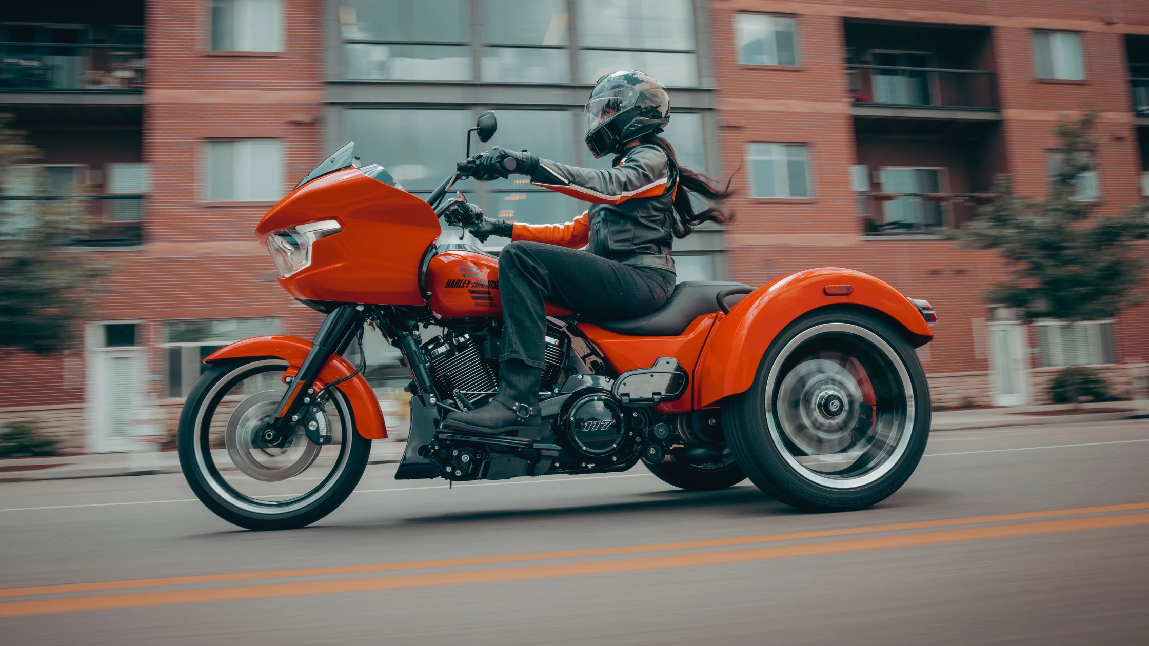 2026 Harley-Davidson® Road Glide® 3 trike riding through an urban street